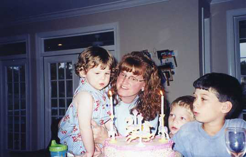 Catie turns 2 and celebrates with another special cake from her Aunt Lynn.  Christine and cousins Austin and Douglas look on
